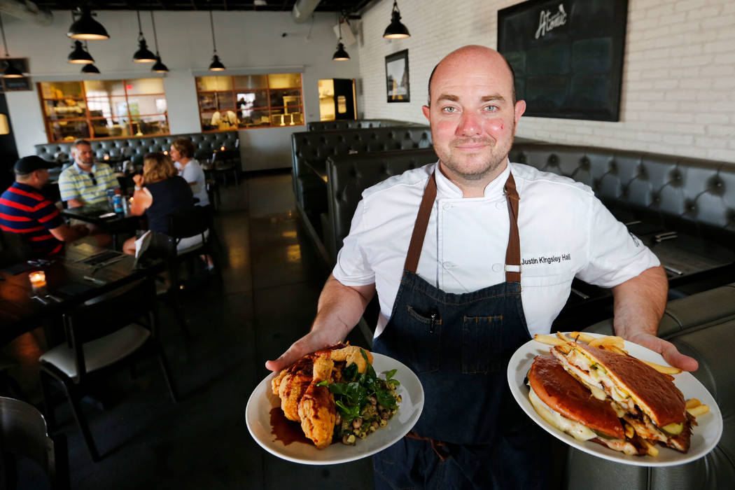 The Kitchen at Atomic Chef Justin Kingsley Hall shows Half-Chicken & Succotash, left, and Cigar City sandwich, right, at his restaurant in Las Vegas, Wednesday, July 11, 2018. Chitose Suzuki L ...