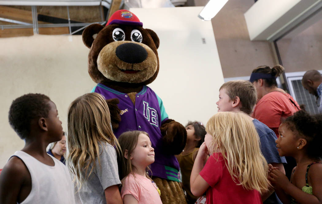 Incredibear from John's Incredible Pizza Company greets kids at the annual Back to School Fair organized by the Happy Face Foundation at Springs Preserve in Las Vegas, Sunday, Aug. 5, 2018. Studen ...