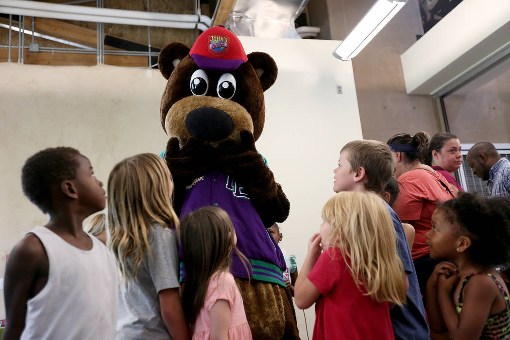 Incredibear from John's Incredible Pizza Company greets kids at the annual Back to School Fair organized by the Happy Face Foundation at Springs Preserve in Las Vegas, Sunday, Aug. 5, 2018. Studen ...