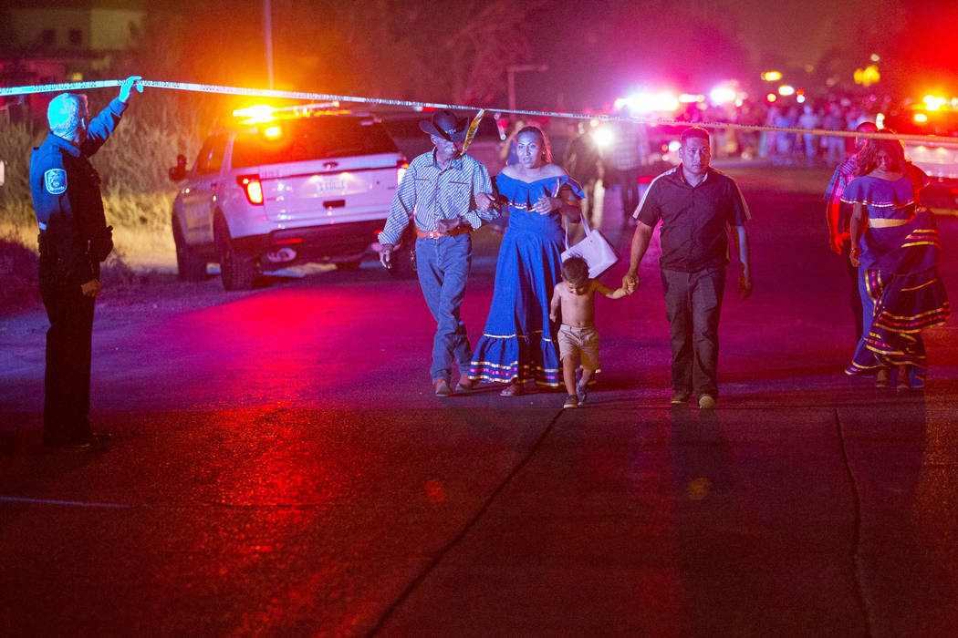 People leave the scene of a shooting that broke outside a party near Allen and Coran lanes in North Las Vegas on Saturday, Aug. 4, 2018. (Richard Brian Las Vegas Review-Journal @vegasphotograph)