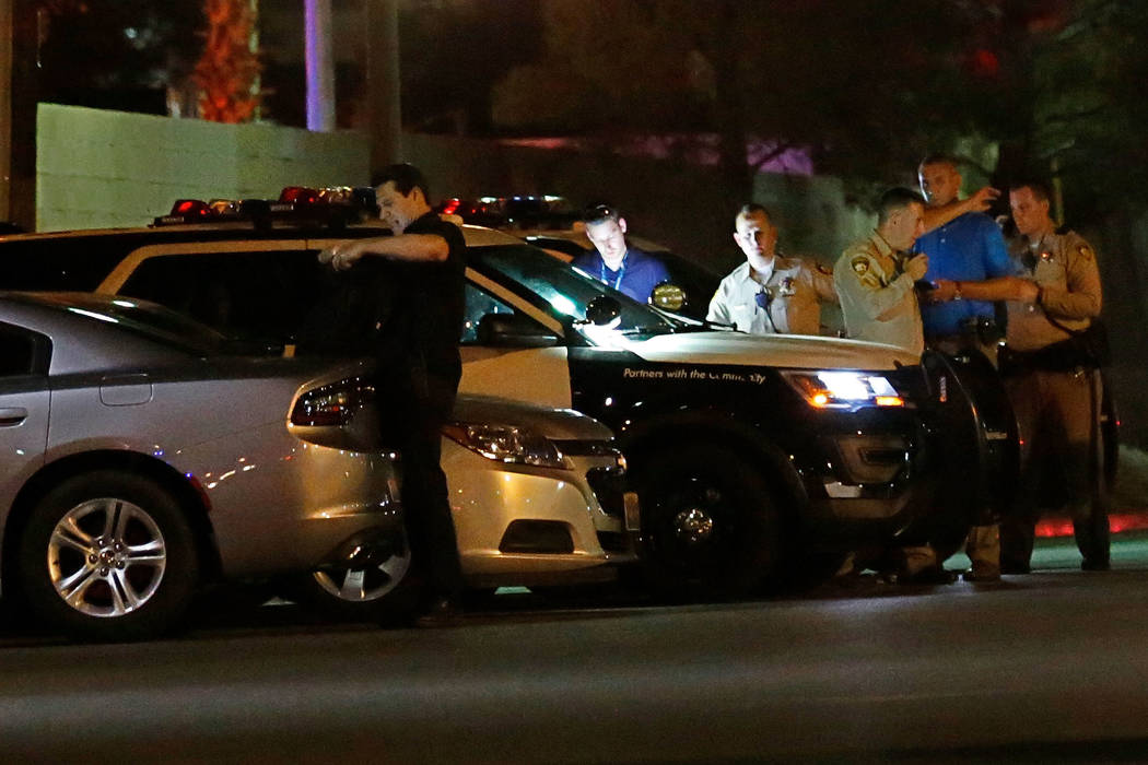 Las Vegas police investigate an officer-involved shooting near an apartment complex in the 5300 block of East Tropicana Avenue in Las Vegas, Wednesday, Aug. 8, 2018. Chitose Suzuki Las Vegas Revie ...
