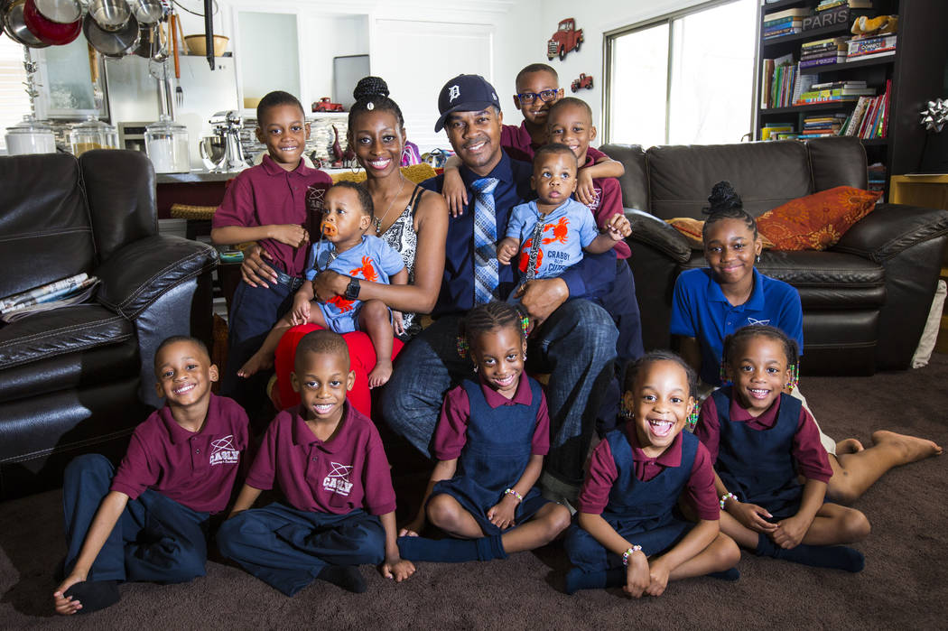 Deon Derrico, center, with wife, Karen Evonne Derrico, and their 11 children at their home in N ...