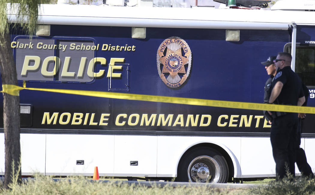 Clark County School District police keep watch outside their mobile command center while investigating a homicide at Canyon Springs High School in North Las Vegas on Tuesday, Sept. 11, 2018. Richa ...