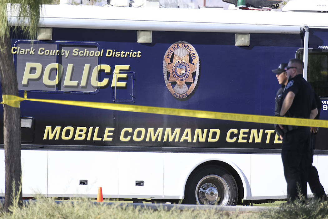 Clark County School District police keep watch outside their mobile command center while investigating a homicide at Canyon Springs High School in North Las Vegas on Tuesday, Sept. 11, 2018. Richa ...
