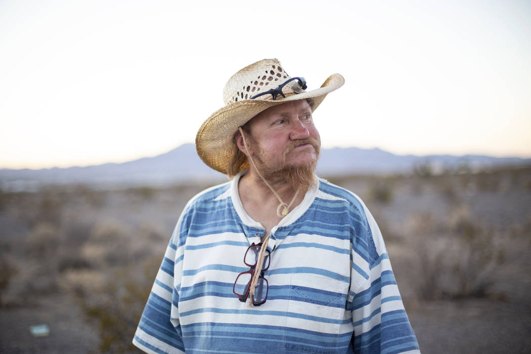 Homeless resident Timothy Persson, 60, poses for a portrait outside of his trailer in Pahrump, ...
