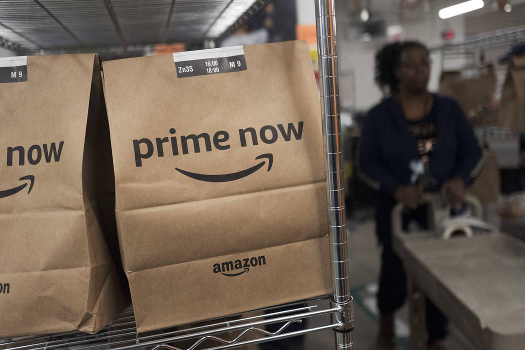 Prime Now customer orders are ready for delivery at the Amazon warehouse in New York, Dec. 20, ...