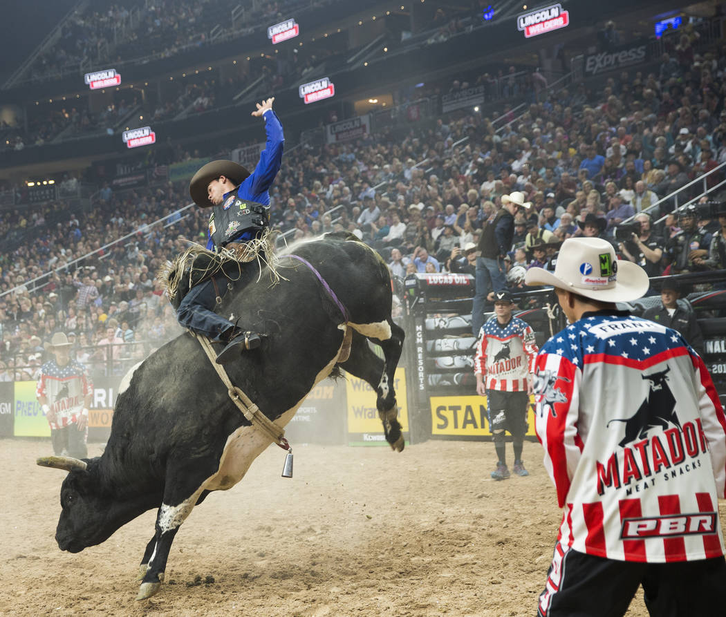 Marco Antonio Eguchi rides "Spotted Demon" during the Professional Bull Riders World Finals on Thursday, November 8, 2018, at T-Mobile Arena, in Las Vegas. Benjamin Hager Las Vegas Revie ...