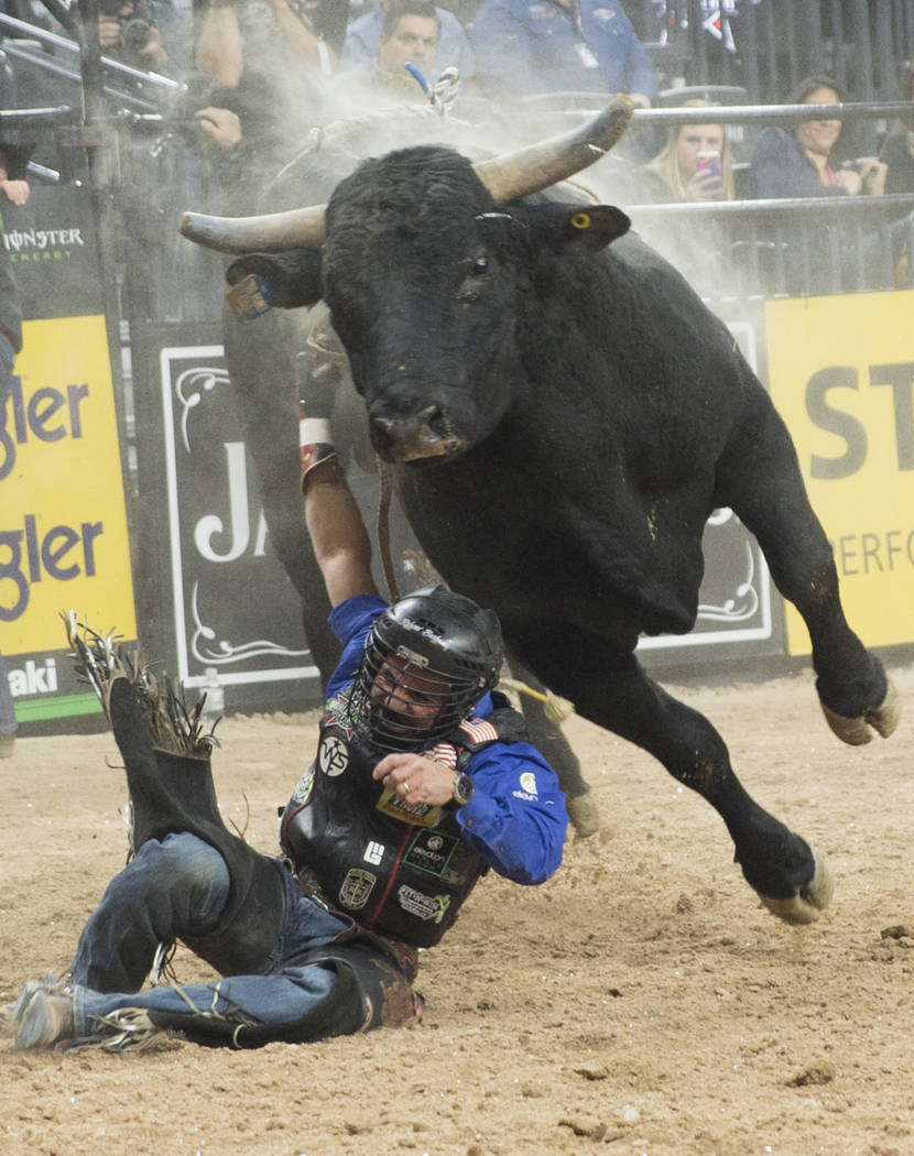 Rubens Barbosa gets tied up with "Hanna Motors Two Point Oh" during the Professional Bull Riders World Finals on Sunday, November 11, 2018, at T-Mobile Arena, in Las Vegas. Benjamin Hage ...