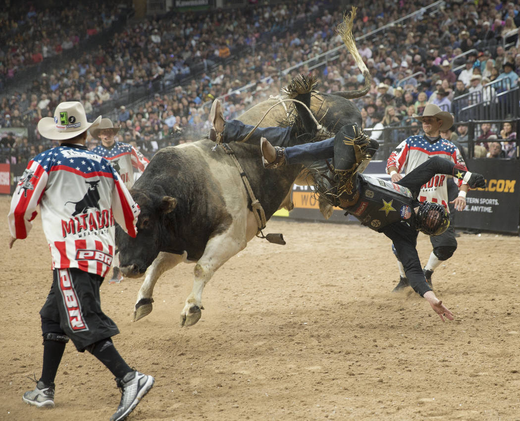 Cody Teel gets thrown off of "Bad Beagle" during the Professional Bull Riders World Finals on Sunday, November 11, 2018, at T-Mobile Arena, in Las Vegas. Benjamin Hager Las Vegas Review- ...