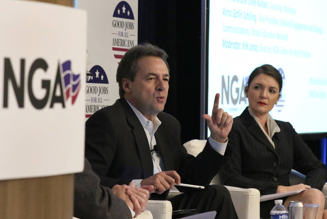 Montana Gov. Steve Bullock speaks as Anna Gatlin Schilling, vice president of National Engagement and Strategic Communications at Strada Education Network, looks on during a panel discus ...