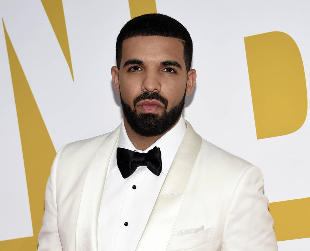 In this June 26, 2017 file photo, Canadian rapper Drake arrives at the NBA Awards in New York. Drake's song "In My Feelings," was named as one of the top songs of the year by Associated Press Mus ...