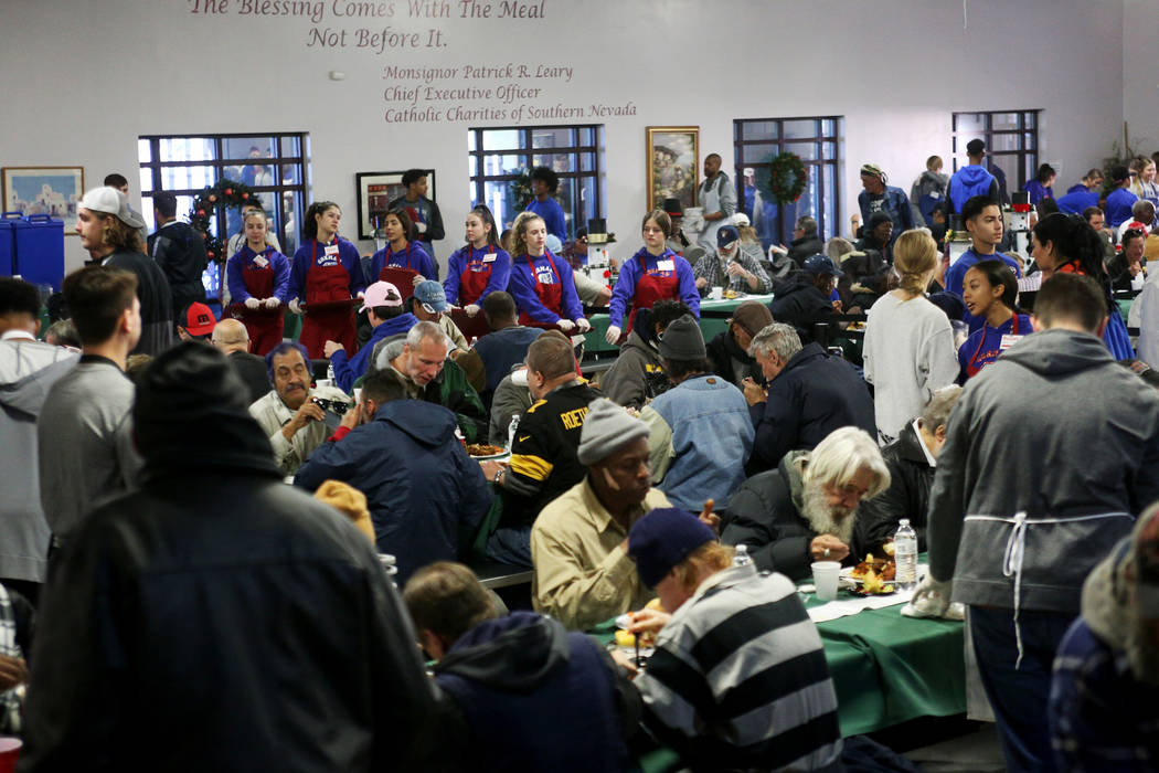 The Christmas meal sponsored by the Frank and Victoria Fertitta Foundation, at Catholic Charities of Southern Nevada in Las Vegas, Sunday, Dec. 16, 2018. Students from the Bishop Gorman High Schoo ...