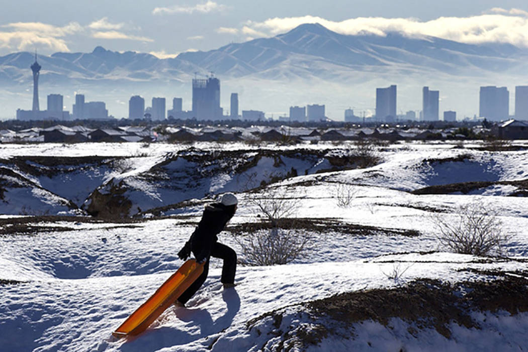 With the Las Vegas skyline looming in the background, Kymberlee Nguyen makes her way to the top ...