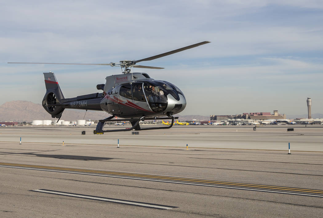 A Maverick tour helicopter lands with McCarran International Airport in the background on Tuesday, Dec. 18, 2018, at Maverick Helicopters, in Las Vegas. Benjamin Hager Las Vegas Review-Journal