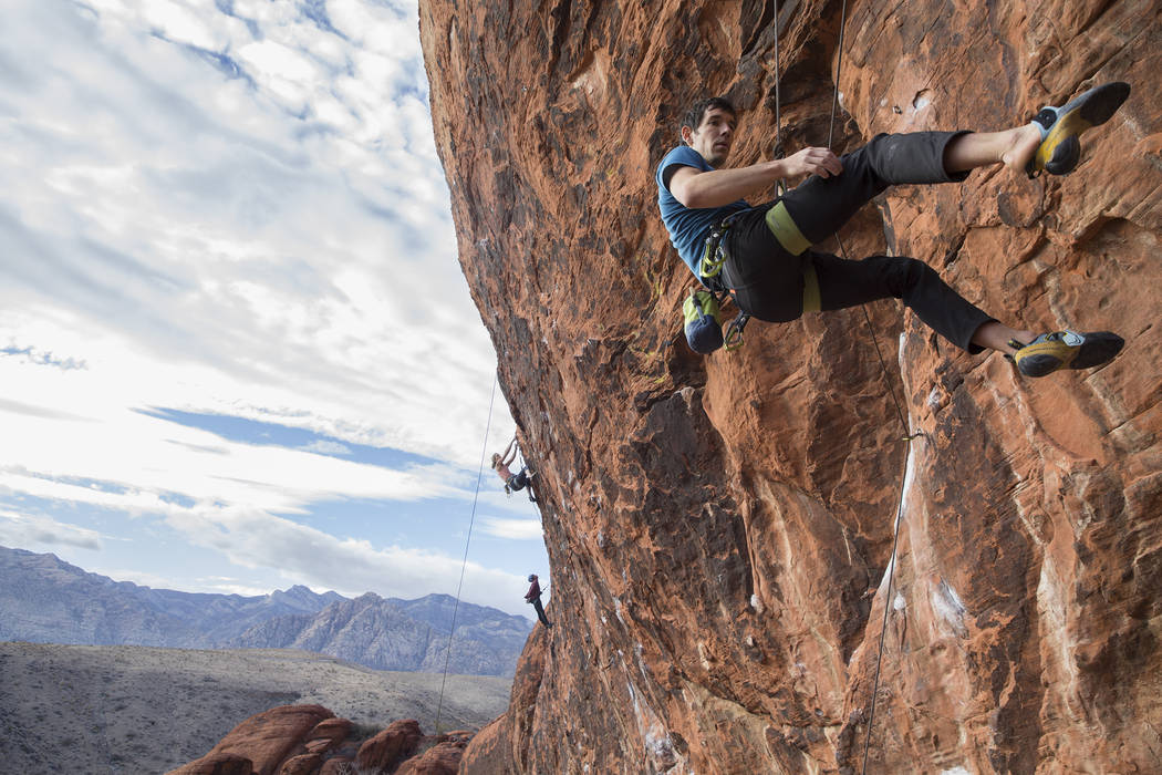 Alex Honnold descends The Gallery at Red Rock Canyon on Monday, Dec. 17, 2018, in Las Vegas. Ho ...