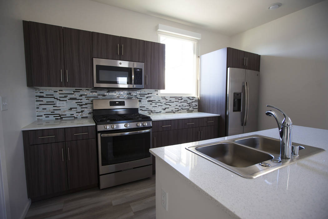 The kitchen area in a residential unit at The Lucy, a multipurpose creative residency created b ...