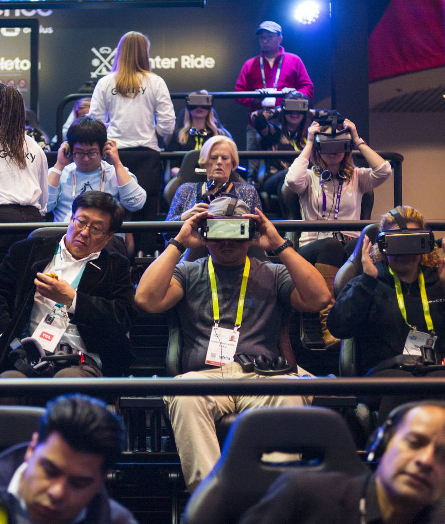Attendees prepare to experience a virtual reality presentation by Samsung during CES at the Las Vegas Convention Center in Las Vegas on Friday, Jan. 12, 2018. Chase Stevens Las Vegas Review-Journa ...