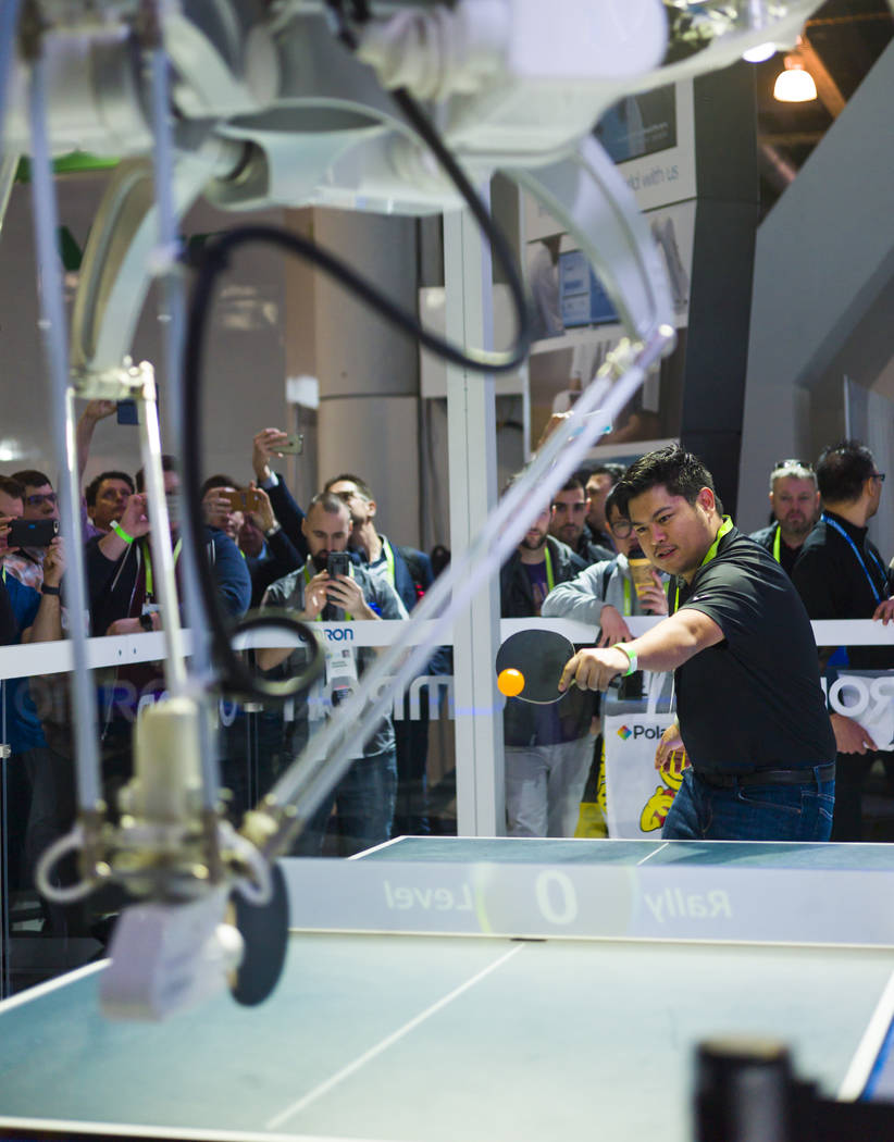 Jordan Alfafara of Las Vegas plays a game of ping-pong against "Forpheus," a robot created by Japanese company Omron, during CES at the Las Vegas Convention Center in Las Vegas on Friday ...