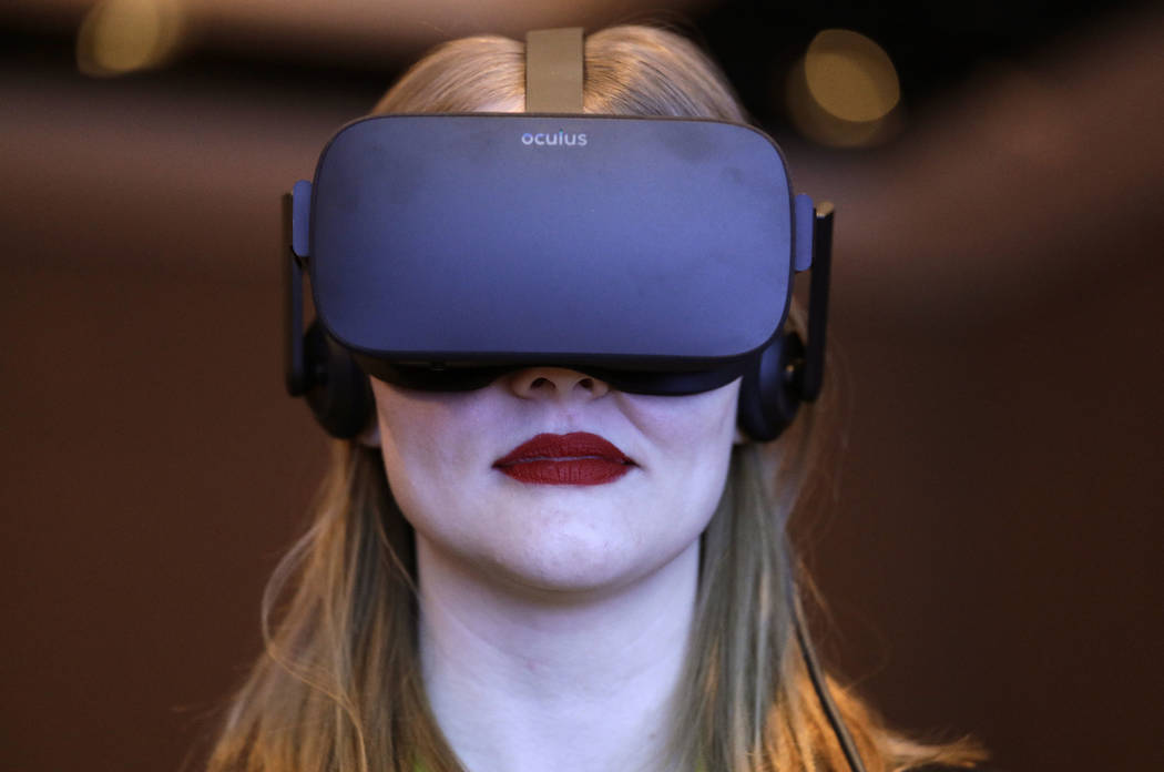 A woman participates in a virtual realty presentation during an Intel news conference before CES International in Las Vegas on Jan. 4, 2017. The weeklong event is one of the world’s largest trad ...