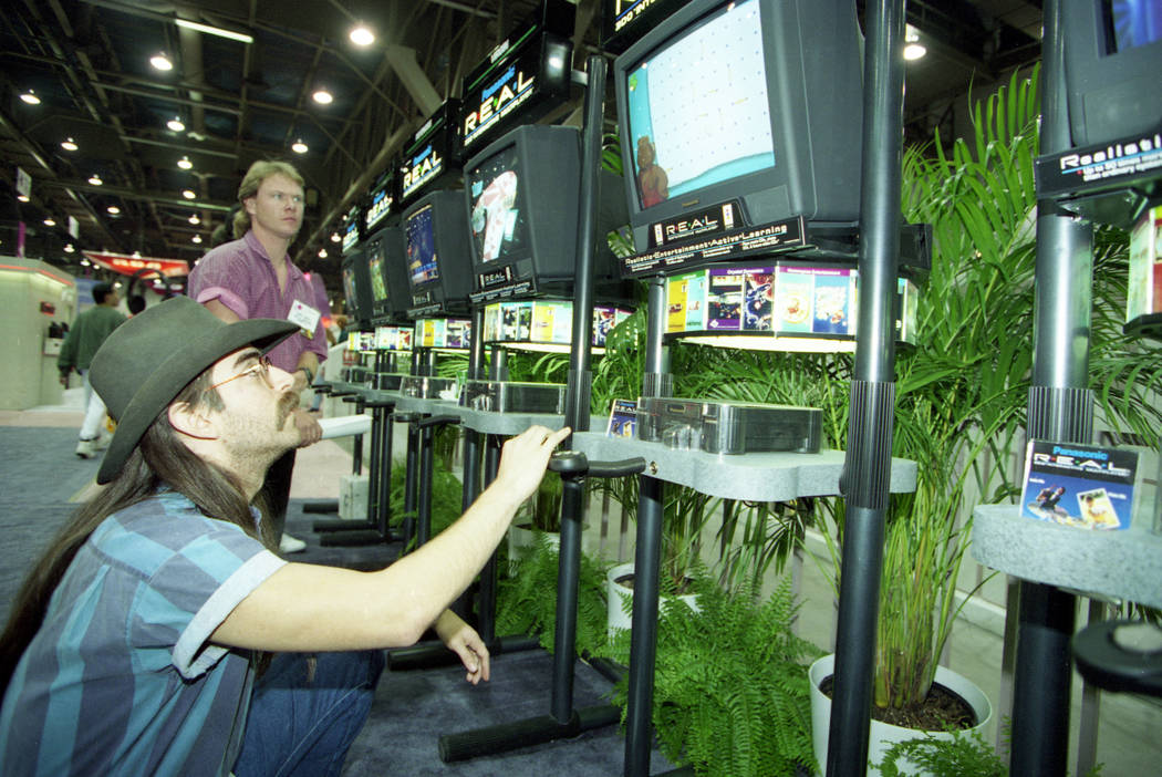 On the last day of the 1994 Consumer Electronics Show, a man plays a Panasonic REAL (Realistic Entertainment Active Learning) game at the Las Vegas Convention Center. (John Gurzinski/Las Vegas Rev ...