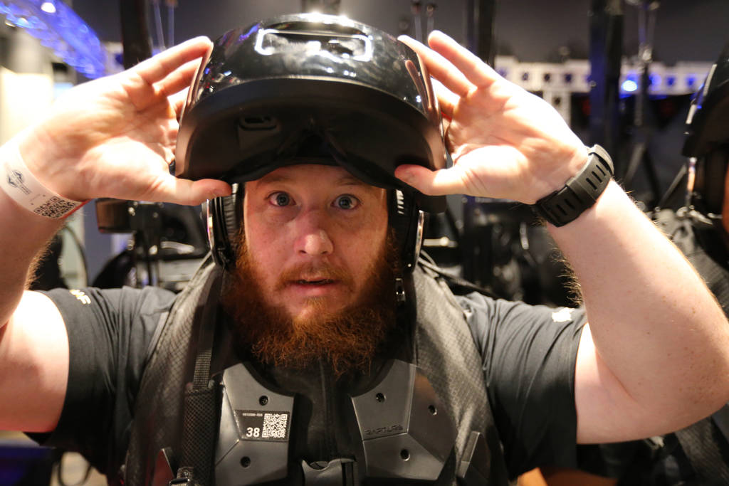 Sean Brown of Las Vegas prepares a VR headset. K.M. Cannon Las Vegas Review-Journal @KMCannonPhoto