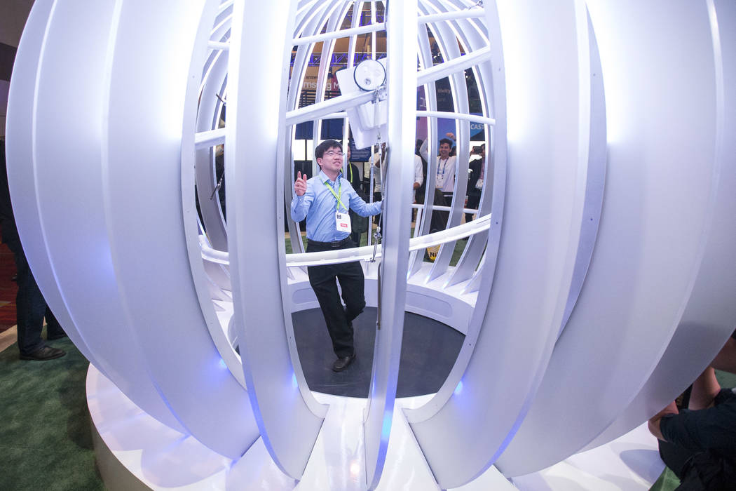 Woo Hyun Lim of South Korea dances in a video booth part of Samsung's Galaxy Experience Zone on day one of CES at the Las Vegas Convention Center in Las Vegas on Tuesday, Jan. 8, 2019. Richard Bri ...