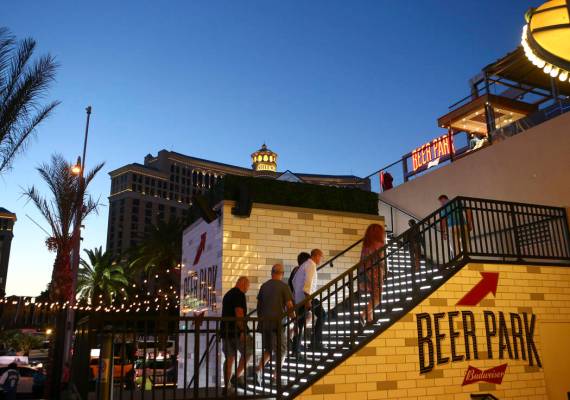 People make their way to Beer Park at the Paris hotel-casino in Las Vegas on Friday, Nov. 4, 20 ...