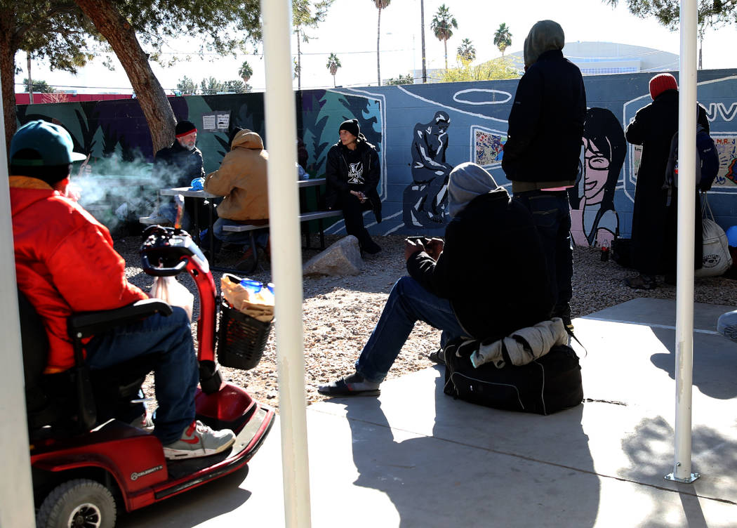 Clients relax at the city of Las Vegas homeless courtyard on Tuesday, Jan. 22, 2019, in Las Veg ...