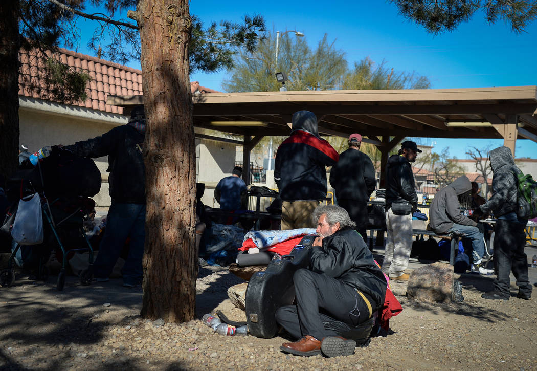 Clients relax at the city of Las Vegas' homeless courtyard in Las Vegas, Thursday, Jan. 24, 201 ...