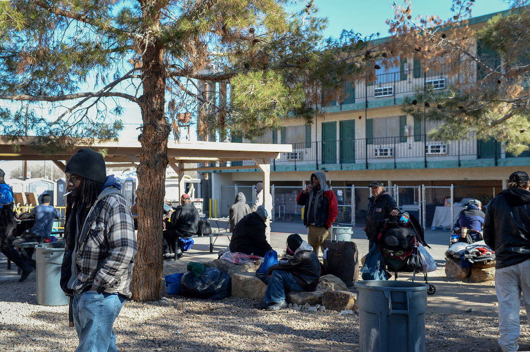 Clients relax at the city of Las Vegas' homeless courtyard in Las Vegas, Thursday, Jan. 24, 201 ...