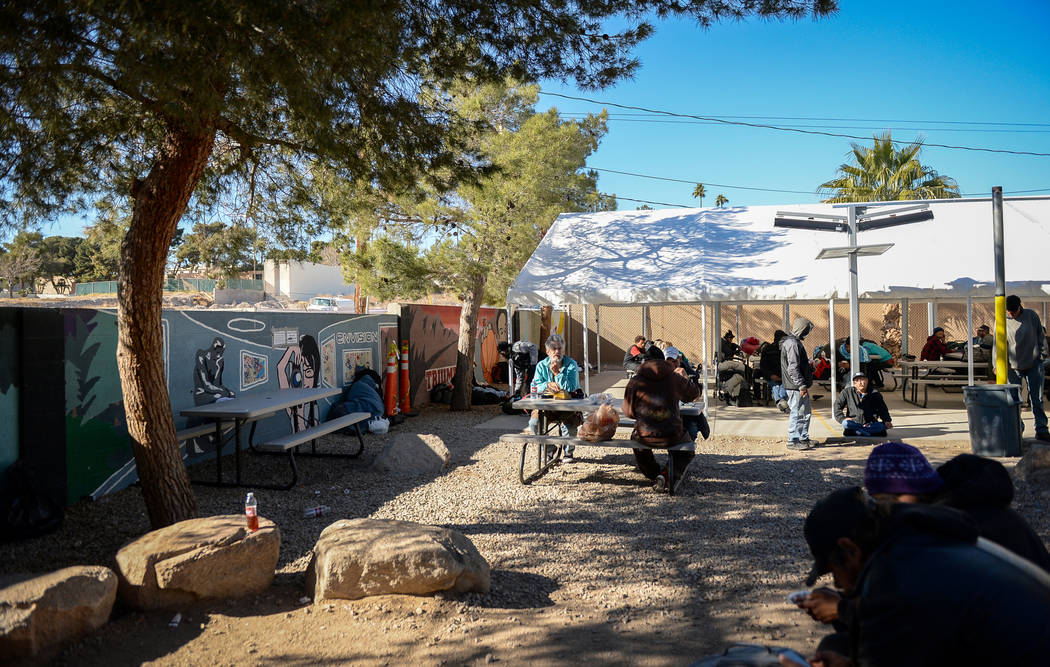 Clients relax at the city of Las Vegas' homeless courtyard in Las Vegas, Thursday, Jan. 24, 201 ...