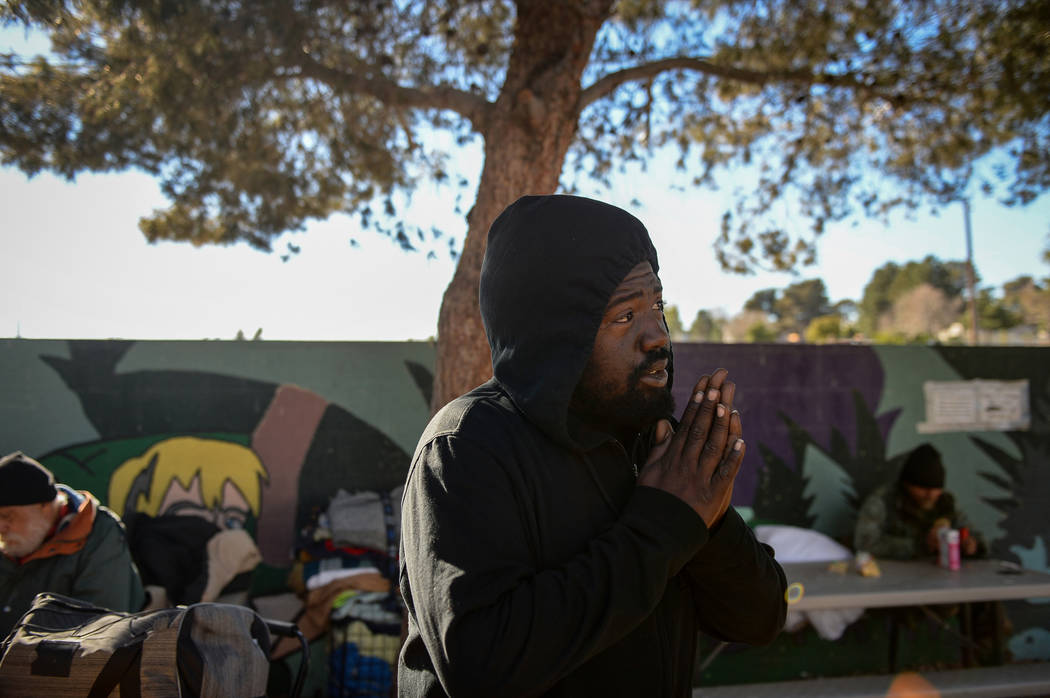 Deshan Banks looks out while chatting with a friend at the city of Las Vegas' homeless courtyar ...