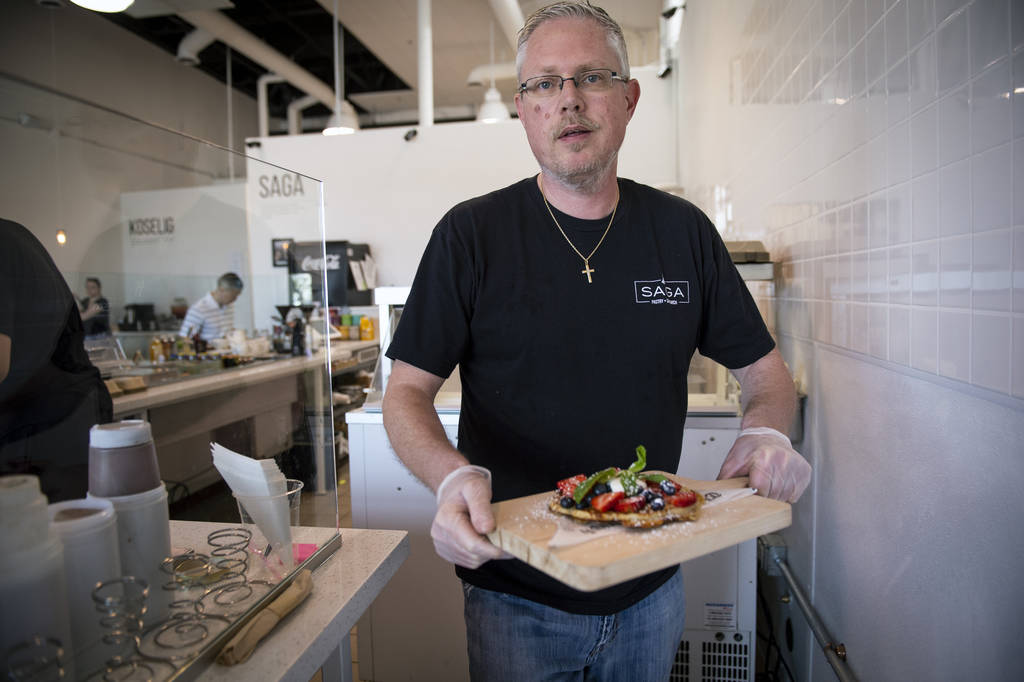 Owner Gert Kvalsund serves a nordic waffle at Saga Pastry + Sandwich in Las Vegas, Sunday, Apri ...