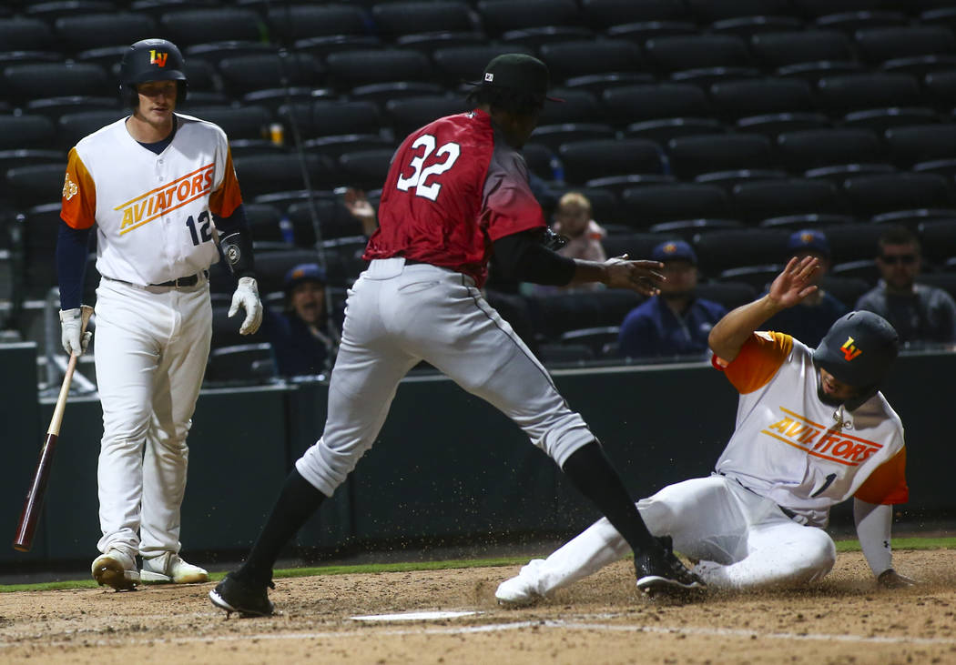 Las Vegas Aviators second baseman Franklin Barreto (1) scores a run against Sacramento River Ca ...