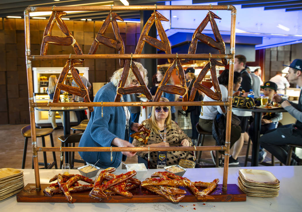 Pretzels shaped in an "A" are amongst the multitude of food items for sale before the ...