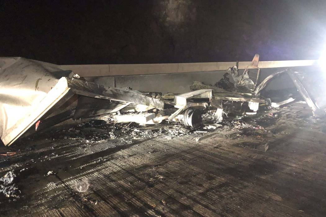 Debris lies on the roadway from a head-on crash between two vehicles on Interstate 11 and U.S. ...