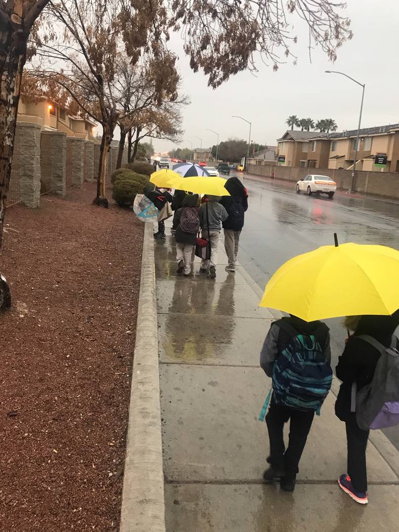 Students walk to school rain, sleet, or snow, Brassard said. Mentors give students umbrellas to ...