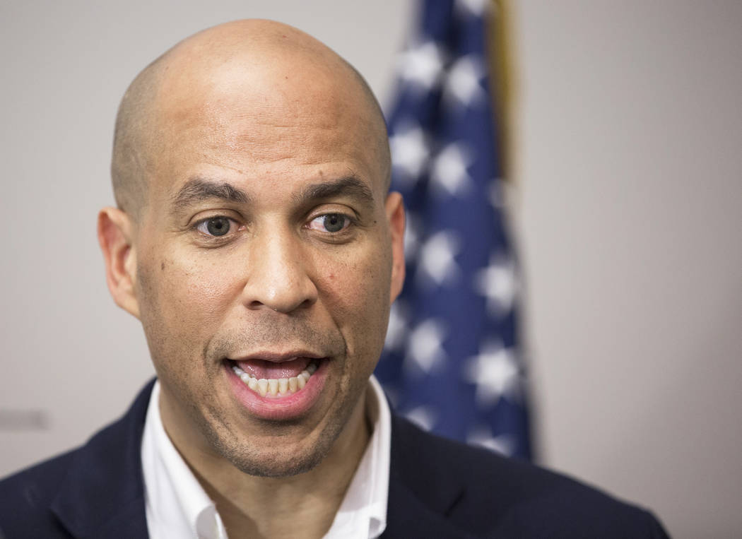 Democratic presidential candidate Sen. Cory Booker, D-N.J. takes questions from the media befor ...