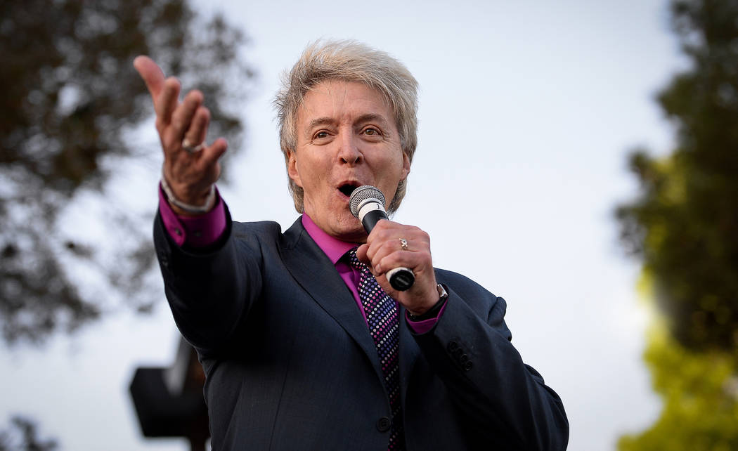 Pastor Bill Walker sings during a sunrise Easter service at the Palm Mortuaries and Cemeteries ...