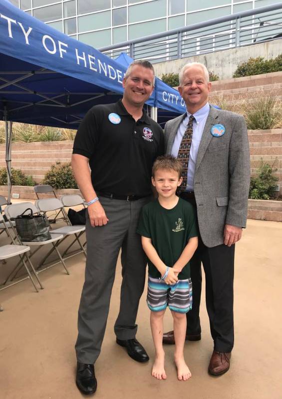 Daniel Pentkowski, president of Henderson Professional Fire Fighters; Landon Foltz; and Henders ...