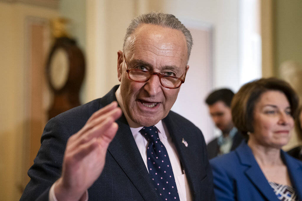 Senate Minority Leader Chuck Schumer, D-N.Y., joined at right by Sen. Amy Klobuchar, D-Minn., s ...