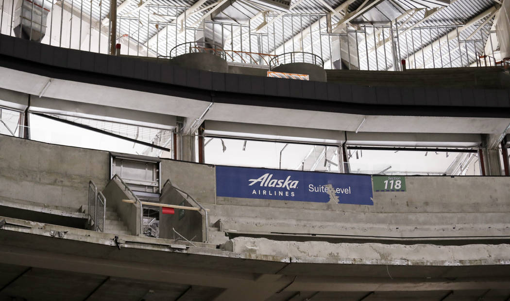 Seats are gone and concrete is partially torn away inside KeyArena in the early stages of demol ...