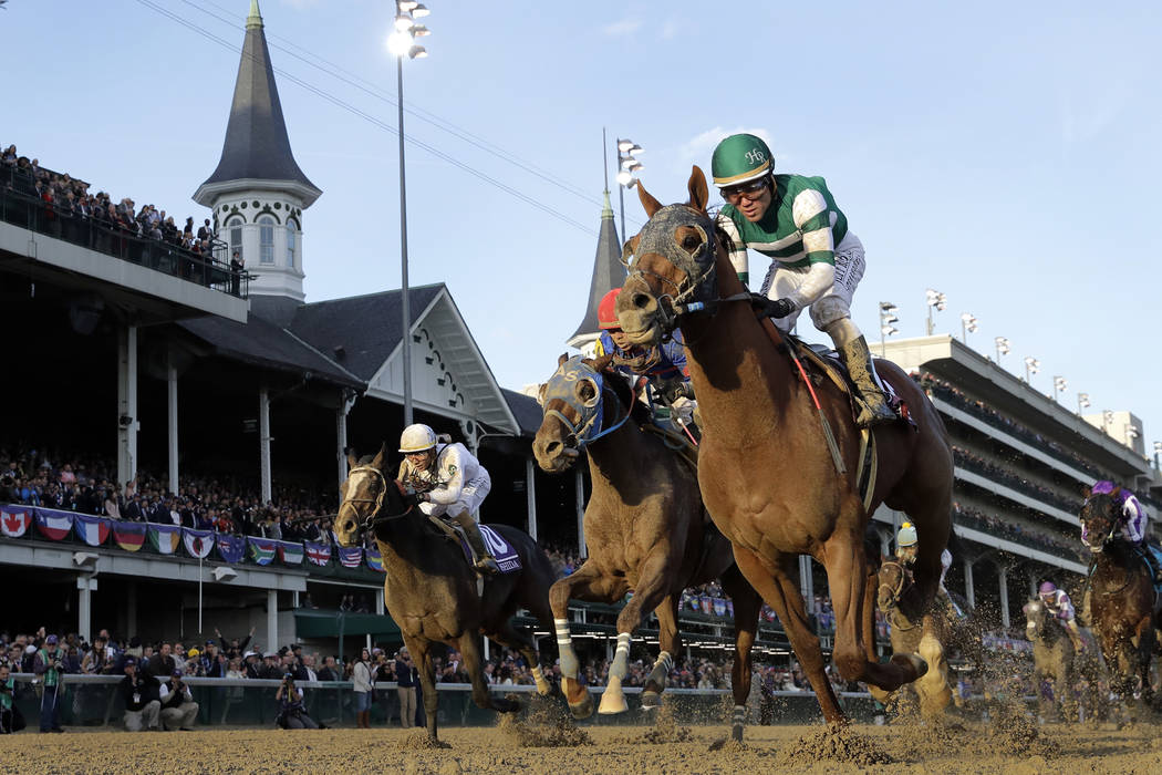 Joel Rosario rides Accelerate to victory in the Breeders' Cup Classic horse race at Churchill D ...