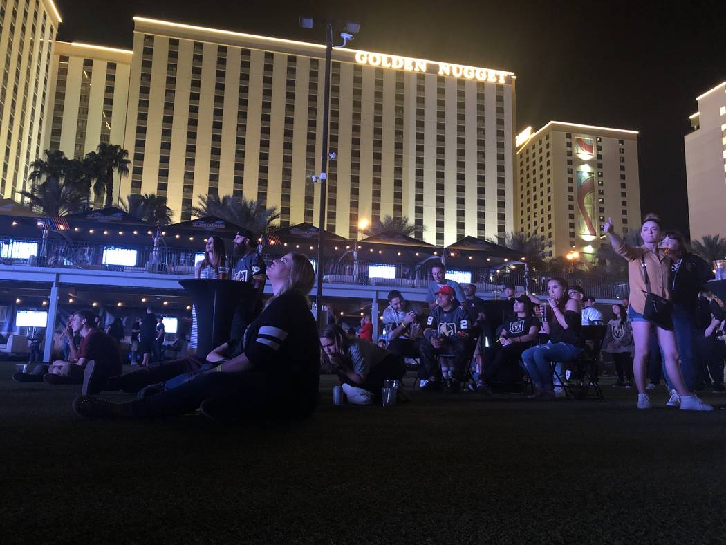 Fans watch on during the fifth game in the playoff series between the Las Vegas Golden Knights ...