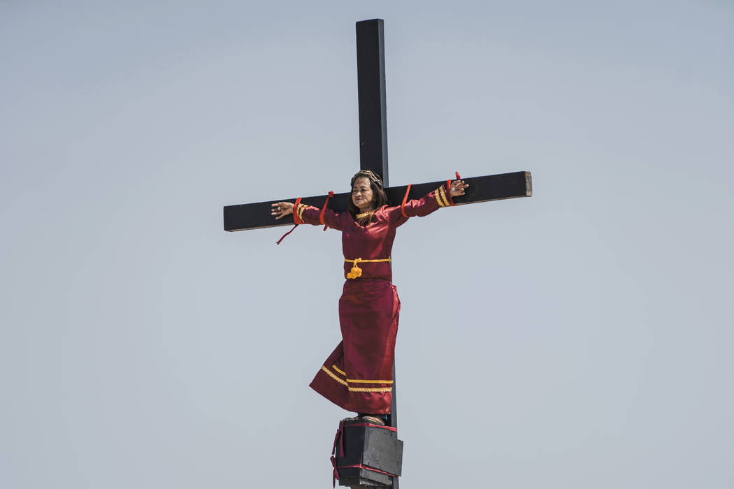 Mary Jane Sazon, the only woman to join in the crucifixion in the village this year, remains ca ...