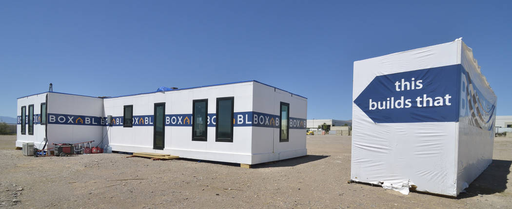 The exterior of a Boxabl home is shown at left in a lot near the company offices at 6120 N. Hol ...