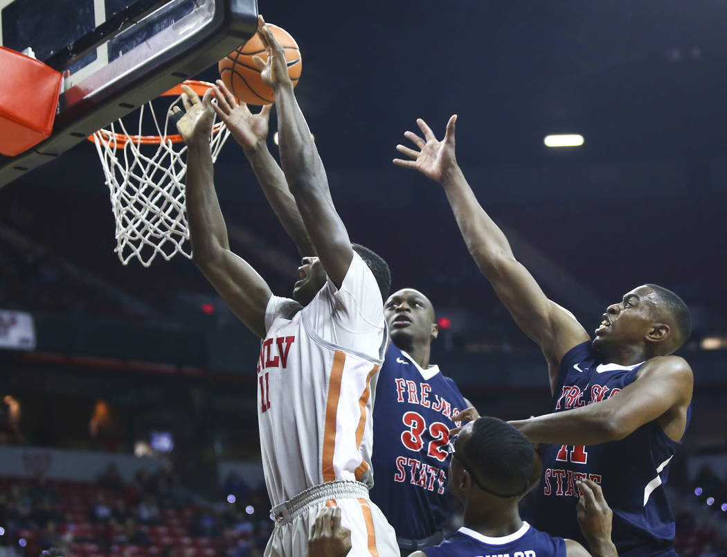 UNLV Rebels forward Cheickna Dembele (11) comes up short on a shot as Fresno State Bulldogs for ...