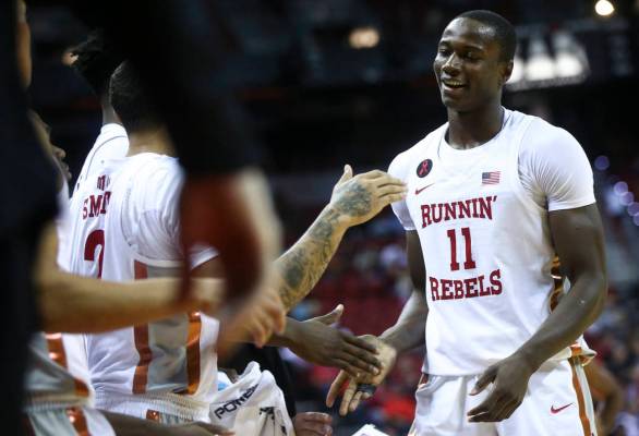 UNLV's Cheickna Dembele (11) returns to the bench while playing Florida A&M during their ba ...