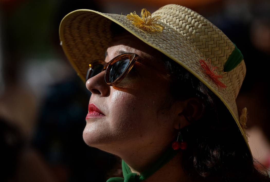 Danika Soto Hay from San Diego, Calif. watches a performance at the pool at The Orleans during ...