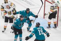 San Jose Sharks defenseman Marc-Edouard Vlasic (44) celebrates with teammates Joe Thornton (19) ...